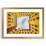Abstract art print of Berlin skyline in muted gold and gray tones, framed with a gold mat, ideal for dining room decor.