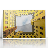 Mid-century modernist art of Berlin skyline in muted gray and blue tones on a framed acrylic.