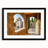 Colorful abstract art print of a European scenery, featuring vibrant hues on a large framed canvas.