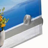 Acrylic print of Santorini landscape with blue and white tones, ideal for dining room art in a mid-century modernist style.