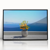 Large abstract wall art depicting the Santorini skyline in muted blue and white tones on a framed acrylic print.