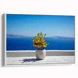 Vintage poster art of Santorini with colorful houses on a framed canvas, ideal for living room decor.