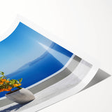 Extra large wall art of Santorini landscape on rolled print, featuring muted blue and white tones.