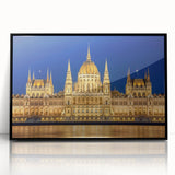 Large abstract wall art featuring a mid-century modernist depiction of a European scenery in black acrylic frame.