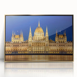 Mid-century modernist art of a European cityscape in muted gold tones on a framed acrylic, suitable for nursery wall art.