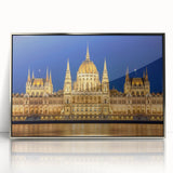 Large art print of a serene Hungarian landscape, featuring muted green and brown tones, in a silver-framed acrylic.