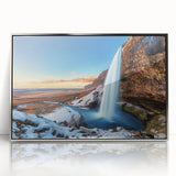 Large art print of a serene Icelandic landscape in muted blues and greens on a framed acrylic.