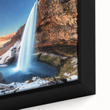 Close-up of a textured black wall art featuring a vibrant Icelandic landscape on a framed canvas.