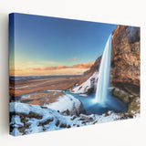 Large art depicting a serene Icelandic landscape in muted greens and blues on a stretched canvas.