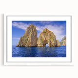 Textured abstract art print of Capri, Italy in muted earth tones on a framed white mat, ideal for bedroom decor.