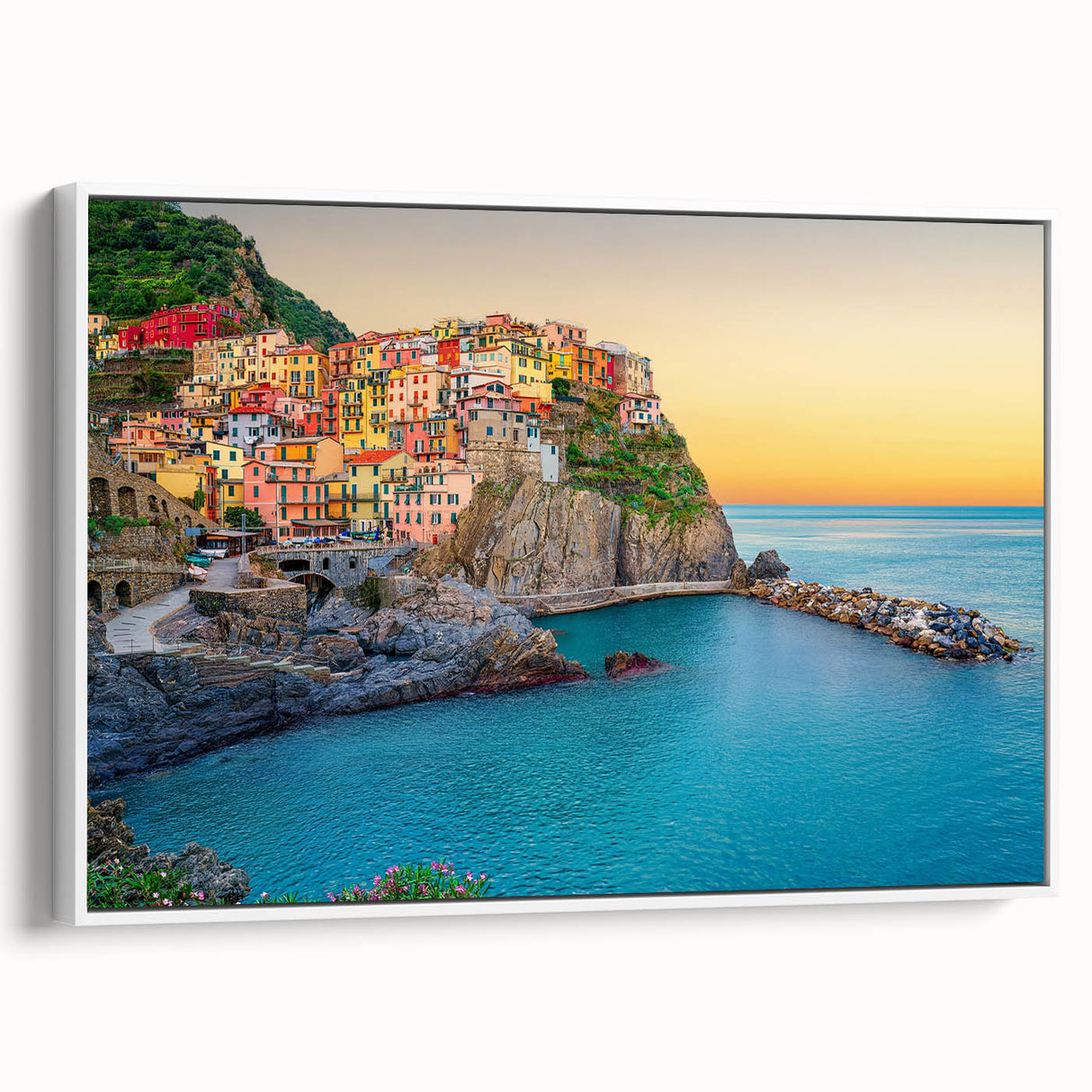 Vintage poster art of Cinque Terre on a framed canvas, featuring vibrant colors against a black background.