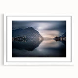 Textured art print of Lake Como with abstract elements in muted blue and green tones, framed with a white mat.