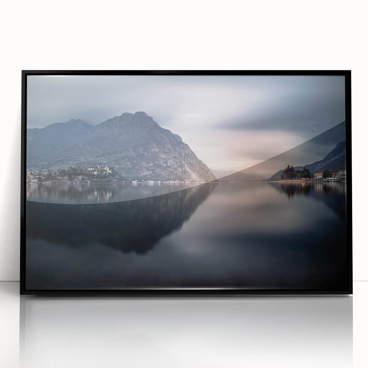 Large abstract wall art of Lake Como with muted blues and greens on a framed acrylic, suitable for modern living room decor.