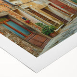 Art deco poster of a Tuscan landscape in muted earth tones on rolled canvas, suitable for dining room decor.