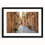 Extra large abstract art print of a colorful, textured Malta scenery on a black framed canvas, ideal for living room decor.