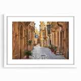 Textured abstract art print depicting a European Malta scenery in muted earth tones, framed with a white mat.