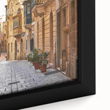 Extra large framed canvas featuring a textured depiction of a Malta scenery in black with colorful art accents.