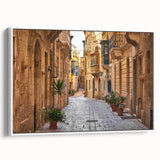 Vintage poster art of a scenic Malta landscape on a framed canvas, featuring colorful art in a white frame.