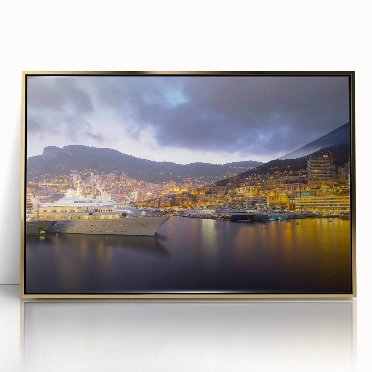 Large art print of Monaco scenery in muted gold and blue tones on acrylic, framed, in a mid-century modernist style.