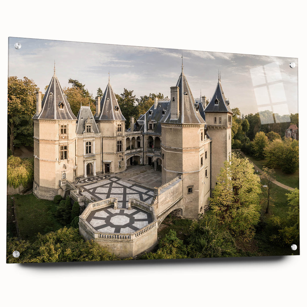 Large abstract wall art of a European scenery on acrylic glass, with muted blue and green tones.