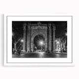 Textured abstract art print of a Barcelona cityscape in muted earth tones on a framed white mat, suitable for bedroom decor.