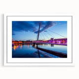 Abstract art print of a European Welsh landscape in muted green and blue tones, framed with a white mat.