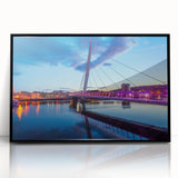 Large abstract wall art depicting a Welsh landscape in muted green and blue tones, framed in black acrylic.