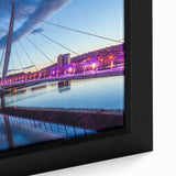 Close-up of extra large framed canvas depicting a textured black wall art scene with colorful European scenery.