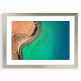 Textured abstract art print depicting Baja California scenery in muted earth tones, framed with a silver mat.