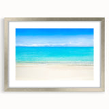 Abstract textured art print of Cancun scenery in silver frame, featuring muted oceanic and sandy hues.