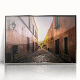 Mid-century modernist art depicting Mexico City, in muted earth tones on a silver-framed acrylic print.