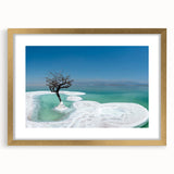 Extra large abstract art print of the Dead Sea in muted blue and beige tones, framed in gold, ideal for living room decor.