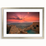 Textured abstract art print depicting a Middle Eastern scenery in muted earth tones, framed with a silver mat.