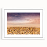 Abstract art print of a Jordanian landscape in muted earth tones on a framed white mat, ideal for dining room decor.