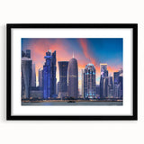Colorful abstract art print depicting vibrant scenery of Qatar, in a black frame with mat, ideal for living room decor.