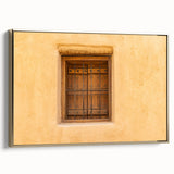 Framed canvas featuring a vintage-style landscape of a Middle Eastern scenery in gold and black tones.