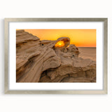 Textured abstract art print of Abu Dhabi scenery in muted earth tones, framed in silver, suitable for bedroom art.