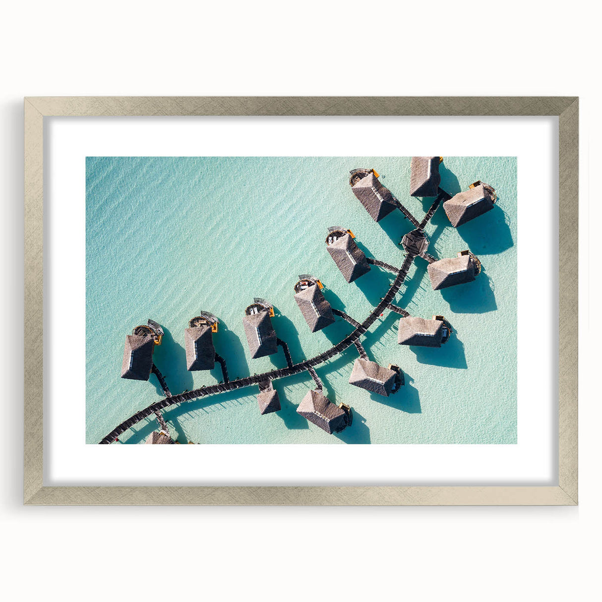 Textured art print of an abstract oceanic scene in cool blue tones, framed in silver, ideal for bedroom art.