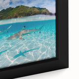 Black wall art featuring a textured representation of Tahiti with vibrant, colorful accents on a large framed canvas.