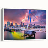 Vintage poster art of Auckland skyline in vibrant colors on a framed canvas, suitable for living room decor.