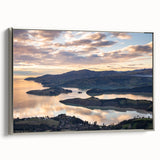 Framed canvas depicting a vintage-style New Zealand landscape in muted earth tones.