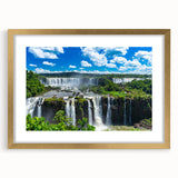 Extra large abstract art print of a textured South American scenery in muted earth tones, framed in gold.