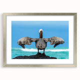 Textured art depicting abstract Galapagos scenery in muted earth tones on a framed silver mat, suitable for bedroom decor.