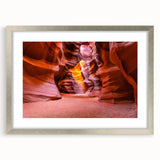 Textured art print of Antelope Canyon in Arizona, featuring swirling orange and brown tones, framed in silver.