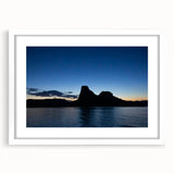 Abstract art print of Lake Powell in muted blue and gray tones, framed with a white mat, ideal for dining room decor.