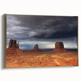 Framed canvas depicting Monument Valley in muted gold and black tones, ideal for bedroom wall art.