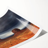 Extra large wall art of Monument Valley in Arizona, featuring vibrant red and orange hues on a rolled print.