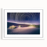 Abstract art print of Death Valley in muted earth tones on a white framed mat, suitable for dining room decor.