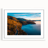 Abstract art print of Lake Tahoe with muted blue and green tones on a framed white mat, ideal for dining room decor.