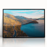 Large abstract wall art of Lake Tahoe in muted blue and green tones, framed in black acrylic.